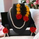 red yellow artificial flower jewellery set on mannequin