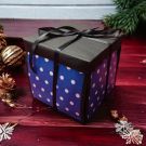 explosion gift box - blue & black - placed on table closed 