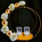 engagement ring platter decorated with off-white and peach color flowers
