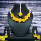simple yellow flower jewellery for haldi on dummy
