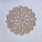 floral MDF rangoli stencil placed on white sheet