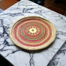 decorated stainless steel thali for pooja placed on table