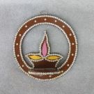 brown colored diya shaped wall mounted diya stand 
