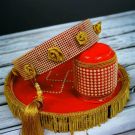 Karwa chauth red thali set - thali-chalni-and water vessel placed on grey wooden countertop