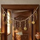 Om swastik lakshmi pearl toran hanging on door