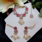 pink fabric jewellery set for haldi/mehandi includes choker necklace, a pair of chandbali earrings, and a maangtika
