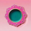 pink-green decorative pooja thali placed on pink countertop