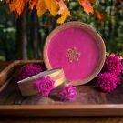 karwa chauth thali set pink colour placed on wooden tray with flowers around