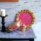 karwa chauth thali set pink colour designed with gota and mirror work placed on marble countertop