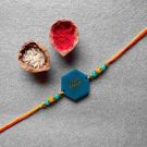 blue 'pyara bhaiya' resin rakhi placed with roli akshat combo