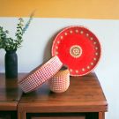 karwachauth red thali set decorated with pearl and stones work placed on wooden table top