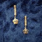 rose gold linear dangle and drop earrings on dark blue velvet