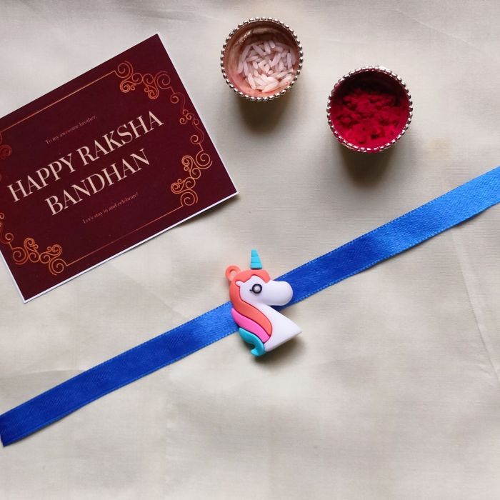3D unicorn rakhi for kids with roli chawal and rakshbandhan card 