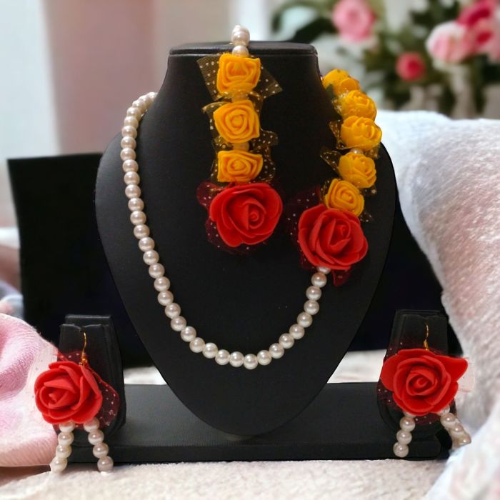 red yellow artificial flower jewellery set on mannequin