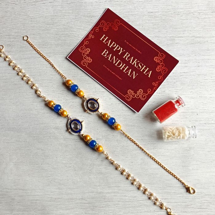blue yellow meenakari rakhi set for brother and bhabhi with roli chawal bottle and rakshabandhan card