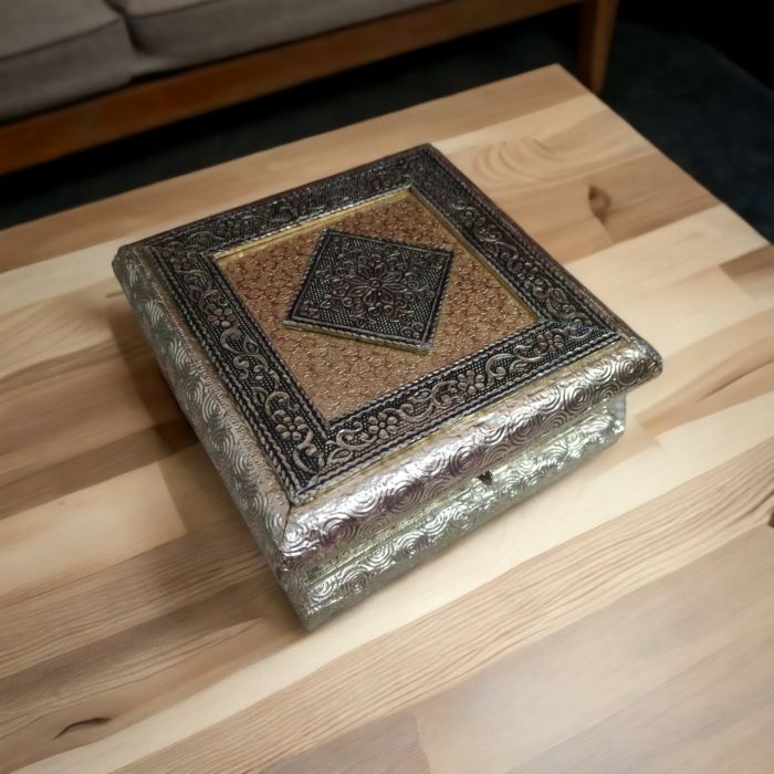 square meenakari dryfruit box placed on table top