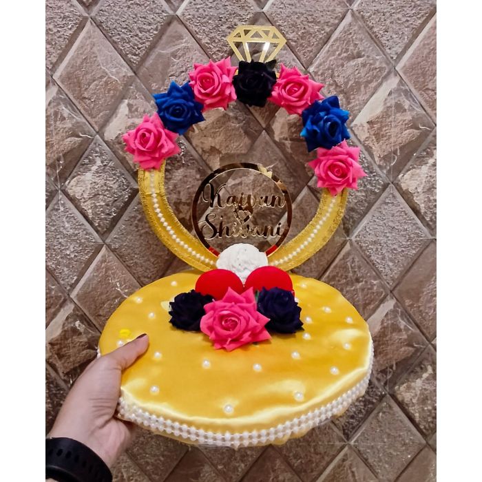 personalized engagement ring platter with diamond shape arch and name of bride and groom in acrylic letters