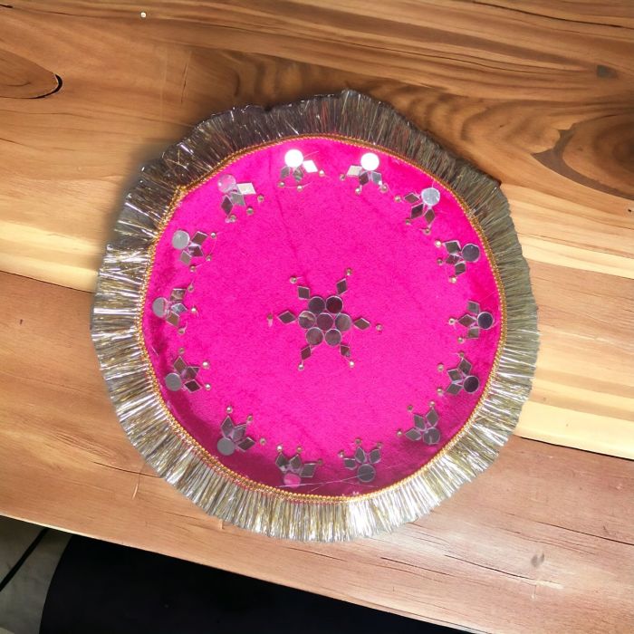 mirror work pink decorative stainless steel thali placed on table