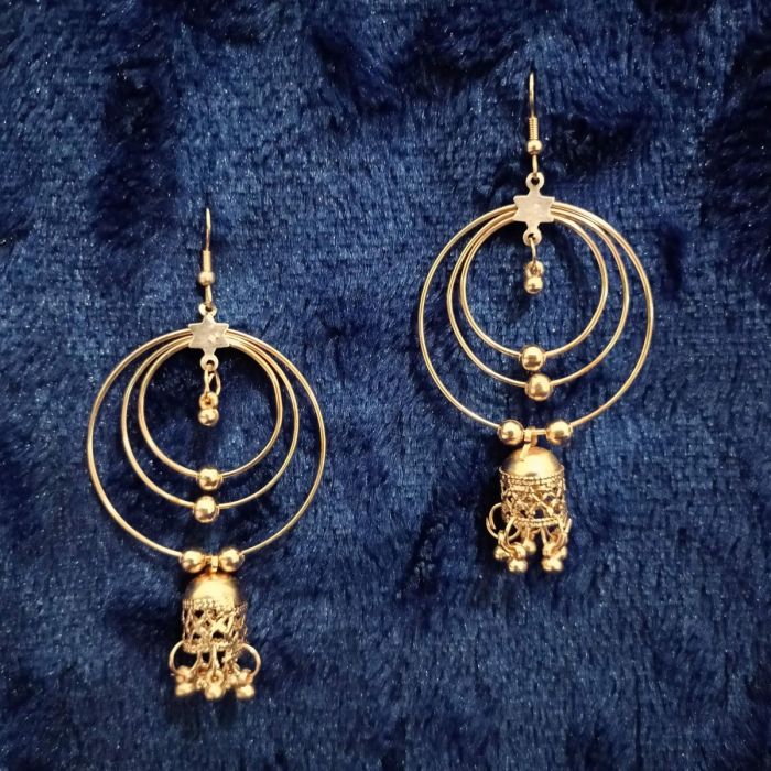 Rose Gold Dangler Jhumkas on dark blue fabric
