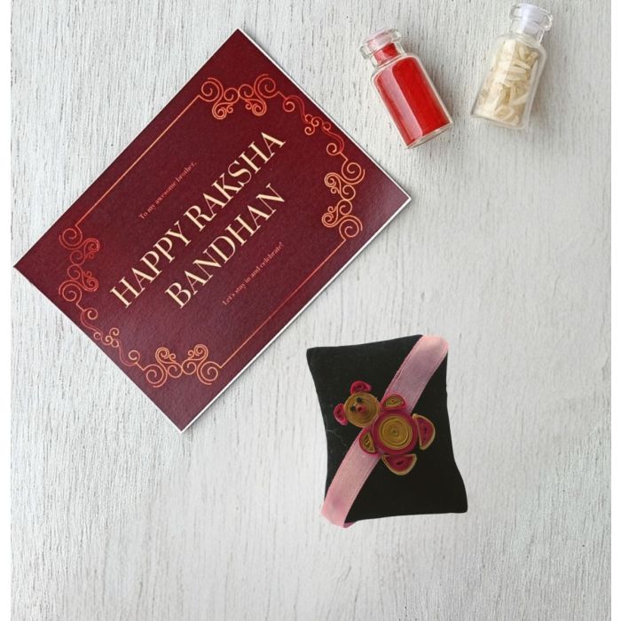 cute teddy bear rakhi made by paper quilling art with roli chawal bottles and Rakshabandhan card 