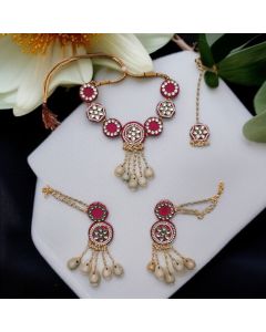 pink fabric jewellery set for haldi/mehandi includes choker necklace, a pair of chandbali earrings, and a maangtika
