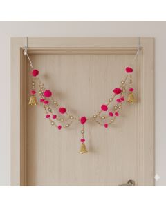 layered golden bead and pink pompom toran 
