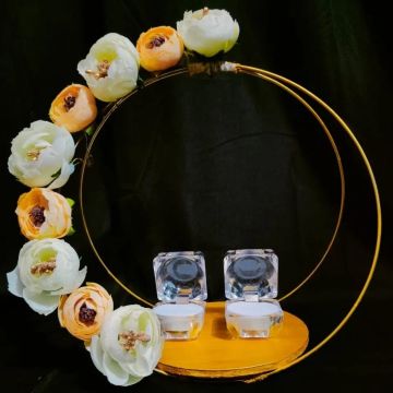 engagement ring platter decorated with off-white and peach color flowers