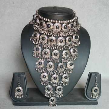 layered oxidised jewellery set for women on mannequin