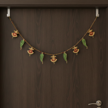mango leaf and shubh, labh, ganesha metal toran hanging on door 