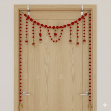 red pompom toran with door side hangings on ivory door frame