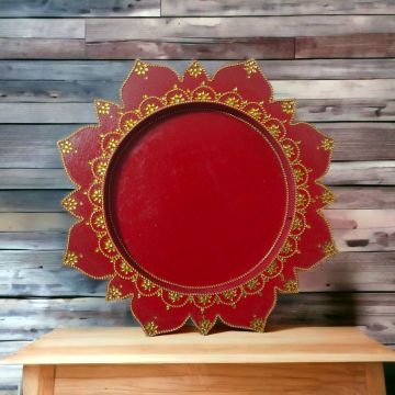 red woden pooja thali placed on table