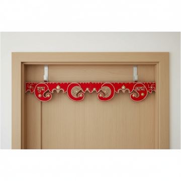 red foldable wooden toran hanging on ivory door of entrance